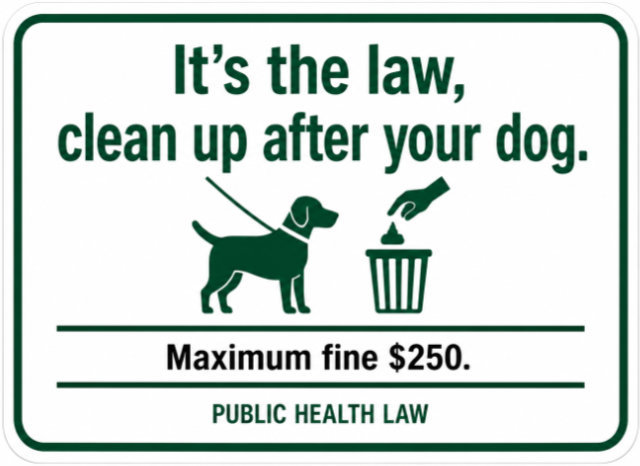 Sign letting people know it's the law to pick up after your dog.